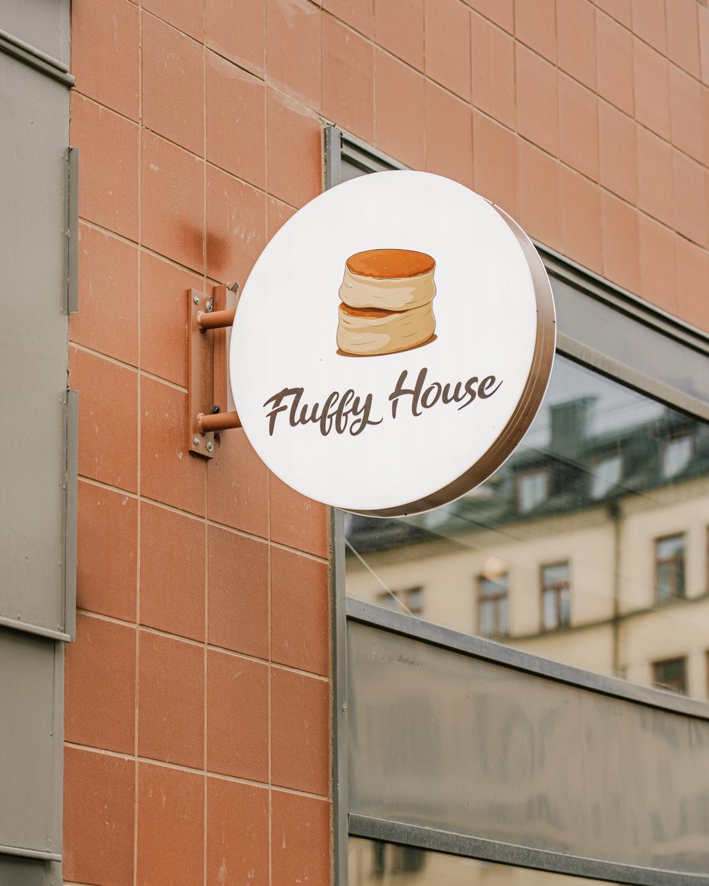 Fluffy House-skylten på fasaden